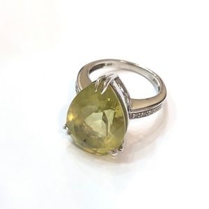 Pear shaped peridot and diamond ring.